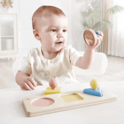 Infant toddler Montessori sensorial puzzle by Hape, shape matching, color matching, and hand eye coordination