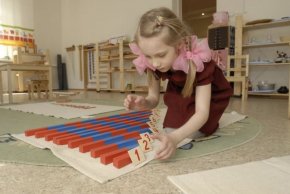 Child working with Montessori Number Rods – Starter Math Shelf by E&O Montessori